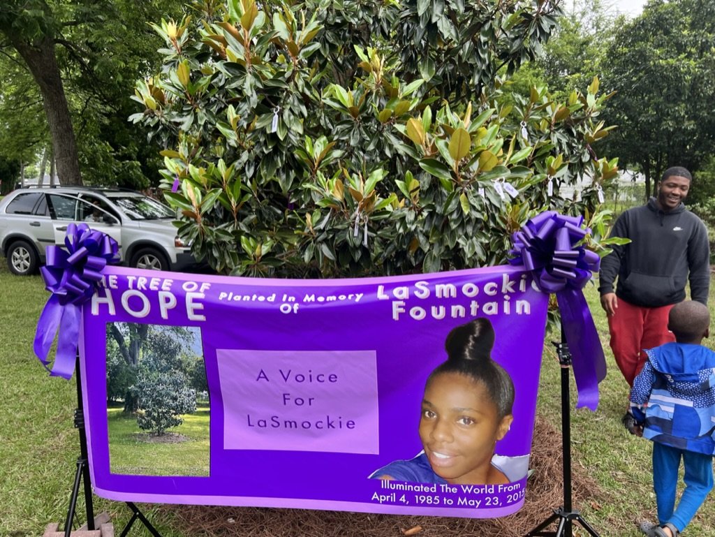 The Tree of Hope banner planted in memory of La'Smockie Fountain at the annual walk in Macon, Georgia supporting people affected by domestic violence.