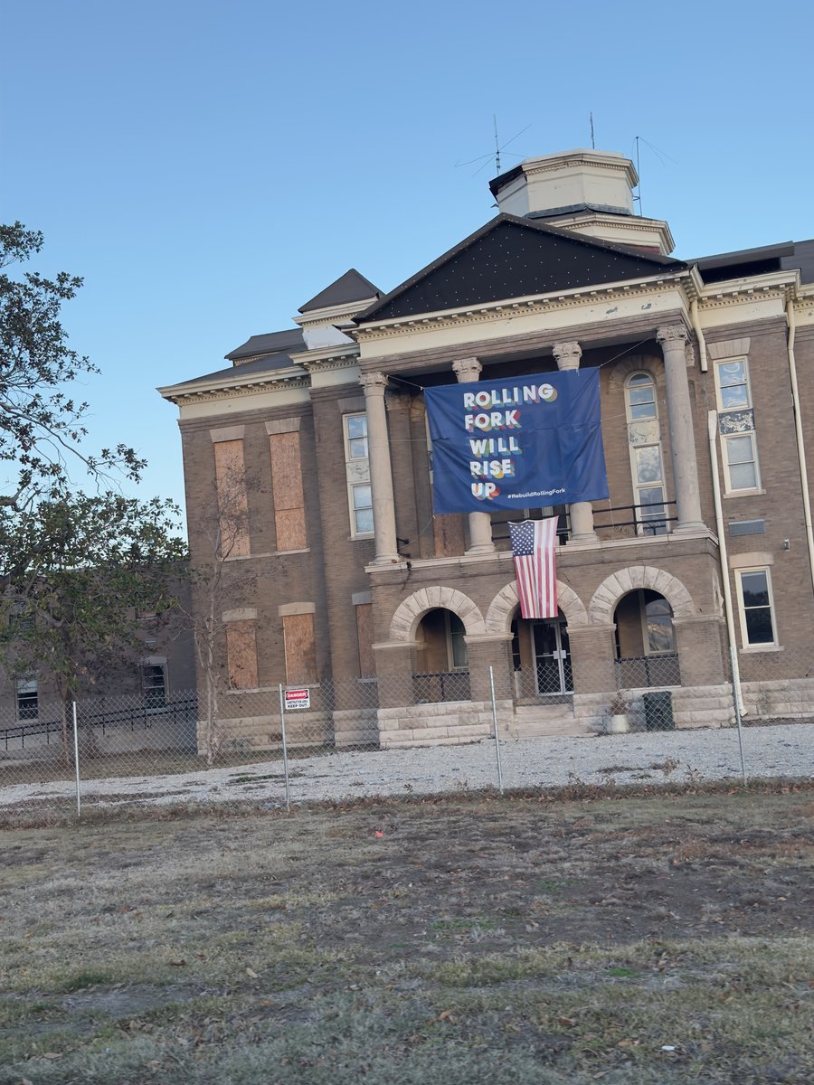 The Rolling Fork, Mississippi courthouse displaying a "Rolling Fork Will Rise Up" banner after the March 2023 tornado.
